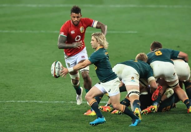 Faf de Klerk of South Africa kicks the ball past Courtney Lawes during the 2nd test match between South Africa Springboks and the British & Irish...