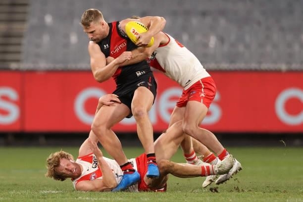 Jake Stringer of the Bombers is tackled during the round 20 AFL match between Essendon Bombers and Sydney Swans at Melbourne Cricket Ground on August...