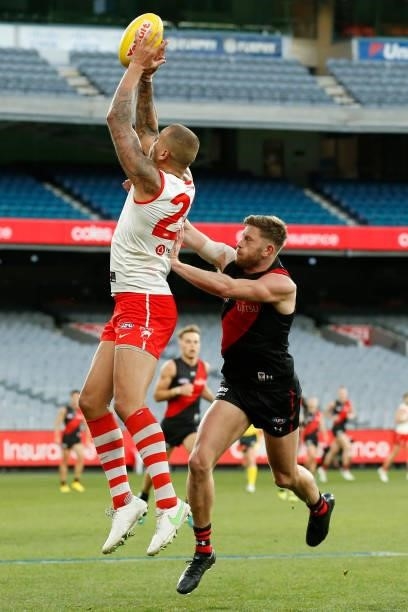 Lance Franklin of the Swans marks the ball in front of Jayden Laverde of Bombers during the round 20 AFL match between Essendon Bombers and Sydney...