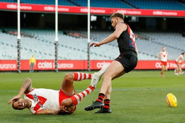 Lance Franklin of the Swans marks the ball in front of Jayden Laverde of Bombers during the round 20 AFL match between Essendon Bombers and Sydney...