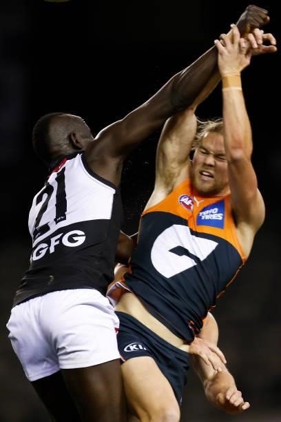 Aliir Aliir of the Power and Harry Himmelberg of the Giants compete during the round 20 AFL match between Greater Western Sydney Giants and Port...