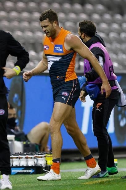Sam J. Reid of the Giants leaves the field with trainers during the round 20 AFL match between Greater Western Sydney Giants and Port Adelaide Power...