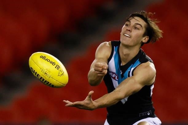 Connor Rozee of the Power handballs during the round 20 AFL match between Greater Western Sydney Giants and Port Adelaide Power at Marvel Stadium on...