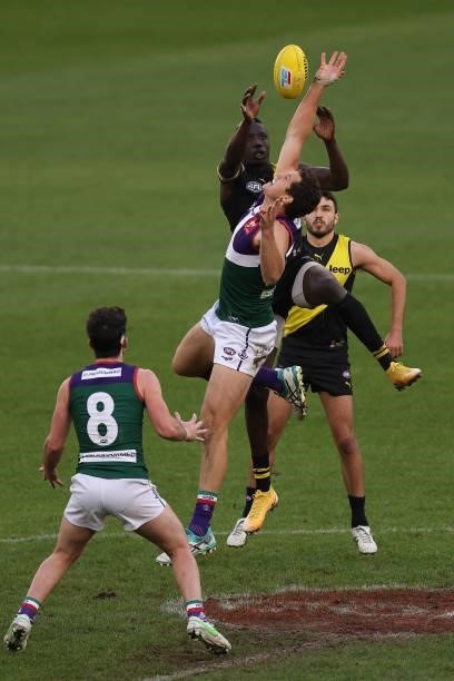 Lloyd Meek of the Dockers contests the ruck against Mabior Chol of the Tigers during the round 20 AFL match between Fremantle Dockers and Richmond...