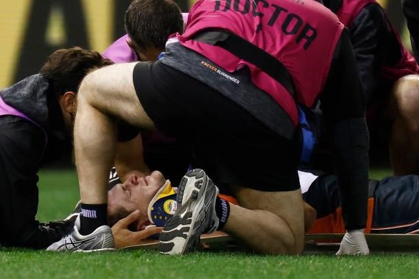 Jacob Hopper of the Giants receives medical attention after being knocked unconscious during the round 20 AFL match between Greater Western Sydney...