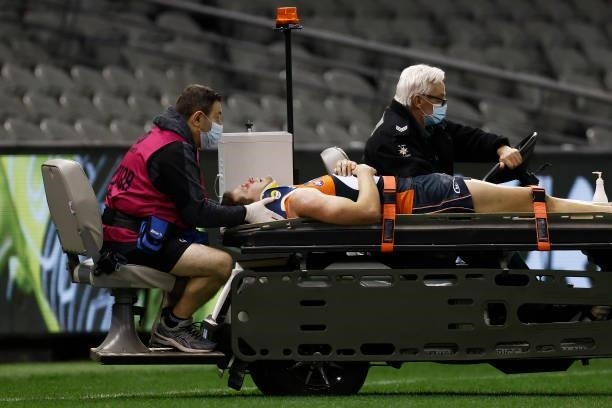 Jacob Hopper of the Giants is stretchered off the ground during the round 20 AFL match between Greater Western Sydney Giants and Port Adelaide Power...