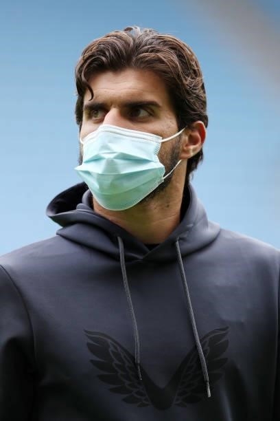 Ruben Neves of Wolverhampton Wanderers is seen wearing a face mask as he inspects the pitch prior to the Pre-Season friendly match between Coventry...