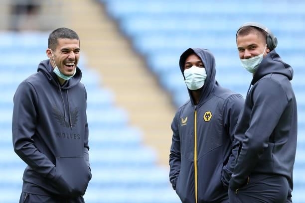 Conor Coady, Adama Traore and Leander Dendoncker of Wolverhampton Wanderers inspect the pitch prior to the Pre-Season friendly match between Coventry...