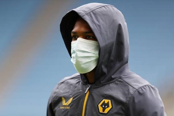 Adama Traore of Wolverhampton Wanderers is seen wearing a face mask as he inspects the pitch prior to the Pre-Season friendly match between Coventry...