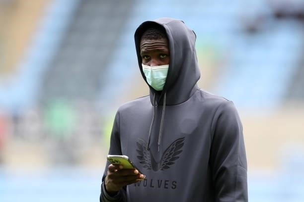 Yerson Mosquera of Wolverhampton Wanderers is seen wearing a face mask as he inspects the pitch prior to the Pre-Season friendly match between...