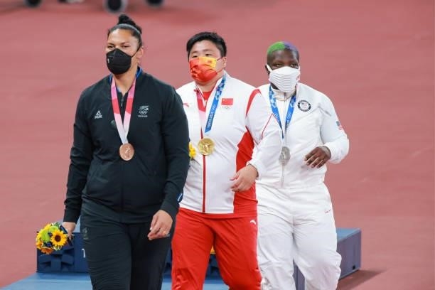 Bronze medalist Valerie Adams of New Zealand, gold medalist Gong Lijiao of China and silver medalist Raven Saunders of United States celebrate during...