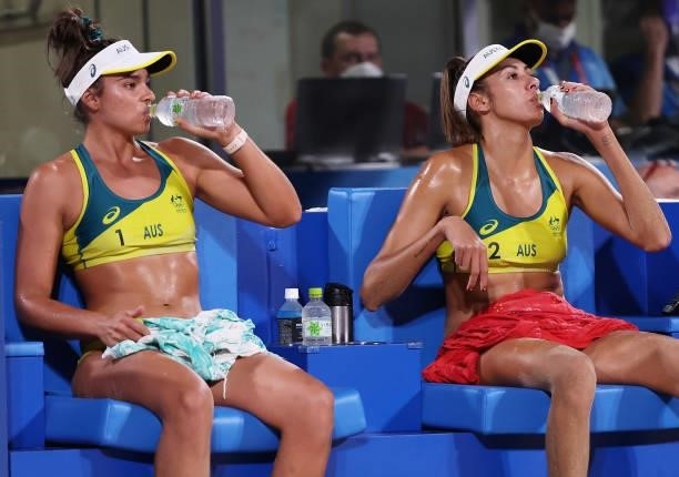 Mariafe Artacho del Solar and Taliqua Clancy of Team Australia take a drink during a break against Team China during the Women's Round of 16 beach...