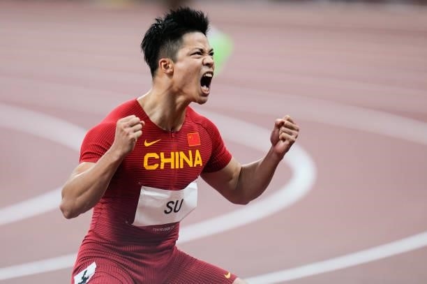 Su Bingtian of China celebrates after winning the Men's 100m Semi-Final on day nine of the Tokyo 2020 Olympic Games at Olympic Stadium on August 1,...