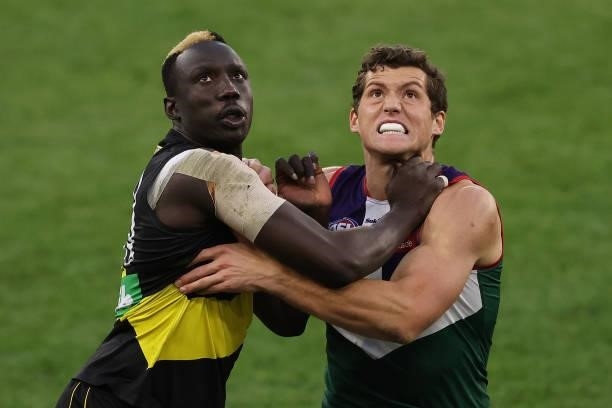 Mabior Chol of the Tigers and Lloyd Meek of the Dockers contest the ruck during the round 20 AFL match between Fremantle Dockers and Richmond Tigers...