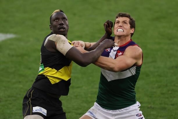 Mabior Chol of the Tigers and Lloyd Meek of the Dockers contest the ruck during the round 20 AFL match between Fremantle Dockers and Richmond Tigers...