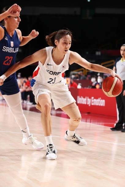 Danbi Kim of Team South Korea drives to the basket against Ana Dabovic of Team Serbia during the first half of a Women's Basketball Preliminary Round...