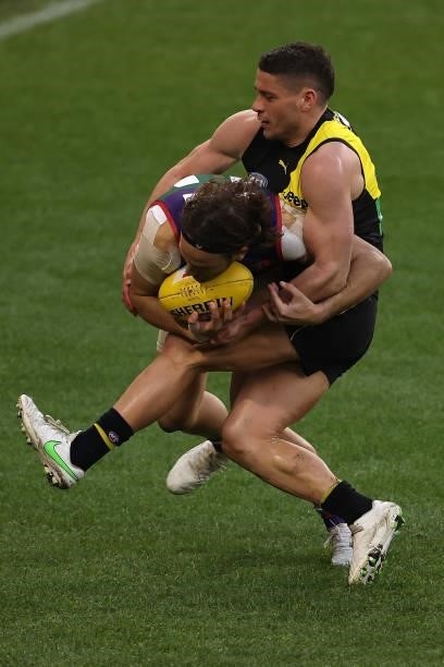 Dion Prestia of the Tigers tackles James Aish of the Dockers during the round 20 AFL match between Fremantle Dockers and Richmond Tigers at Optus...