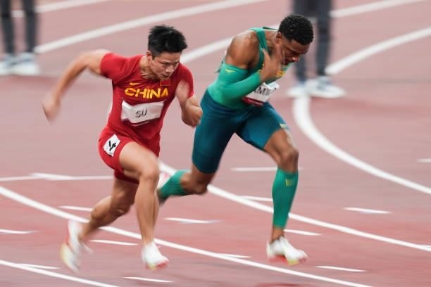 Su Bingtian of China and Paulo Andre Camilo of Brazil compete in the Men's 100m Semi-Final on day nine of the Tokyo 2020 Olympic Games at Olympic...