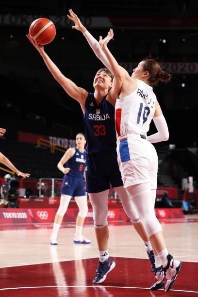 Tina Krajisnik of Team Serbia drives to the basket against Ji Su Park of Team South Korea during the second half of a Women's Basketball Preliminary...