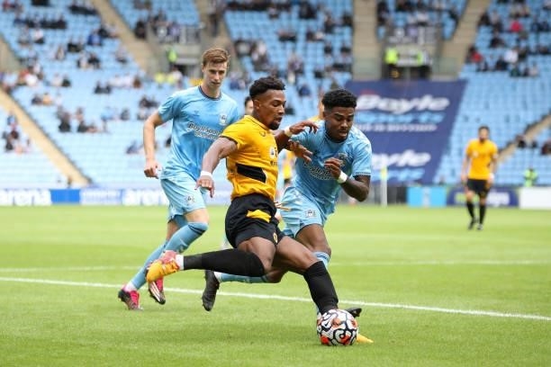 Adama Traore of Wolverhampton Wanderers battles for possession as he attempts to cross the ball during the Pre-Season friendly match between Coventry...