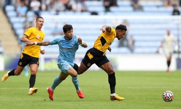 Adama Traore of Wolverhampton Wanderers runs with the ball whilst under pressure from Gustavo Hamer of Coventry City during the Pre-Season friendly...