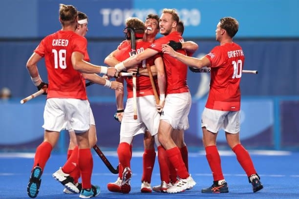 Samuel Ian Ward of Team Great Britain celebrates with teammates after scoring their team's first goal during the Men's Quarterfinal match between...