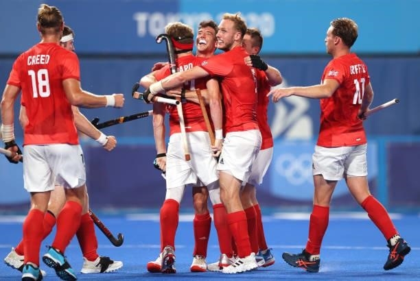 Samuel Ian Ward of Team Great Britain celebrates with teammates after scoring their team's first goal during the Men's Quarterfinal match between...