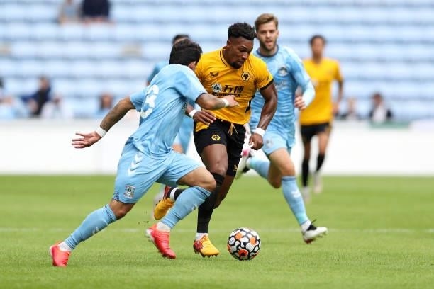 Adama Traore of Wolverhampton Wanderers runs with the ball whilst under pressure from Gustavo Hamer of Coventry City during the Pre-Season friendly...
