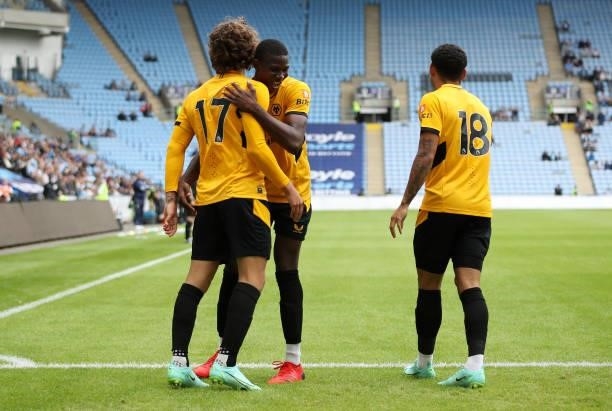 Fabio Silva of Wolverhampton Wanderers celebrates with Yerson Mosquera and Morgan Gibbs-White after scoring their side's first goal during the...