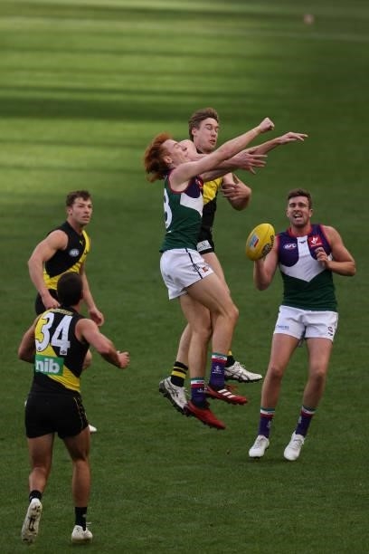 Tobe Watson of the Dockers and Tom J. Lynch of the Tigers contest for a mark during the round 20 AFL match between Fremantle Dockers and Richmond...