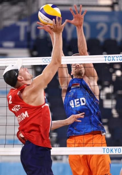 Christian Sandlie Sorum of Team Norway competes against Robert Meeuwsen of Team Netherlands during the Men's Round of 16 beach volleyball on day nine...