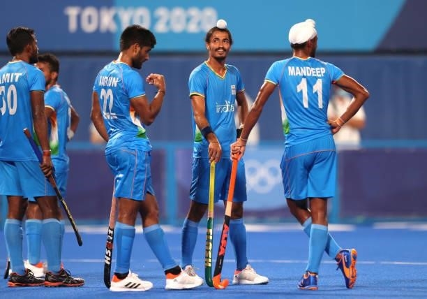 Dilpreet Singh of Team India and teammates await the result of a video referral during the Men's Quarterfinal match between India and Great Britain...