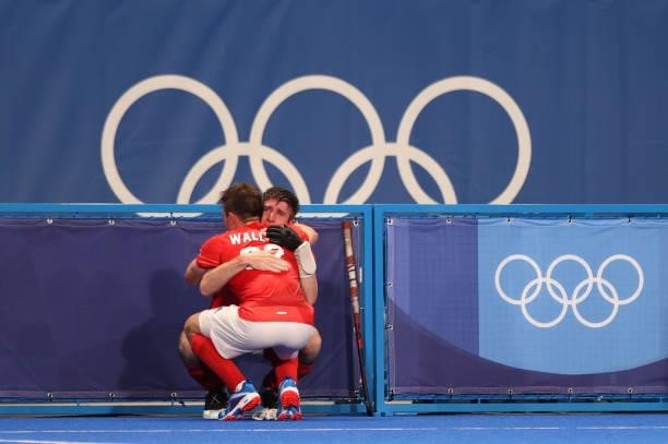 Zachary Wallace embraces teammate Liam Sanford of Team Great Britain following a loss in the Men's Quarterfinal match between India and Great Britain...