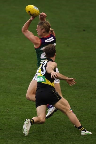 Hayden Young of the Dockers handballs during the round 20 AFL match between Fremantle Dockers and Richmond Tigers at Optus Stadium on August 01, 2021...