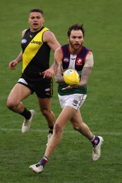 Nathan Wilson of the Dockers handballs during the round 20 AFL match between Fremantle Dockers and Richmond Tigers at Optus Stadium on August 01,...