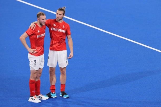 Brendan William John Creed of Team Great Britain consoles teammate David Ames following a loss in the Men's Quarterfinal match between India and...
