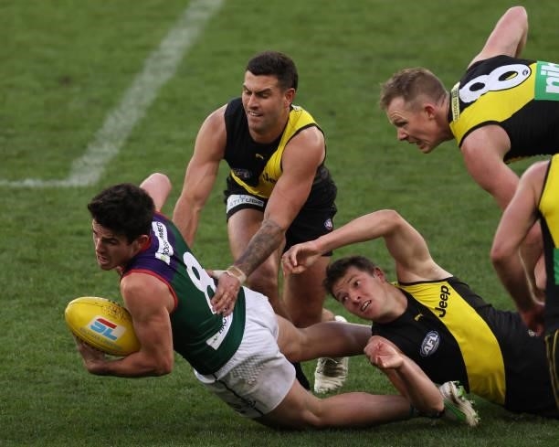 Andrew Brayshaw of the Dockers looks to handball during the round 20 AFL match between Fremantle Dockers and Richmond Tigers at Optus Stadium on...