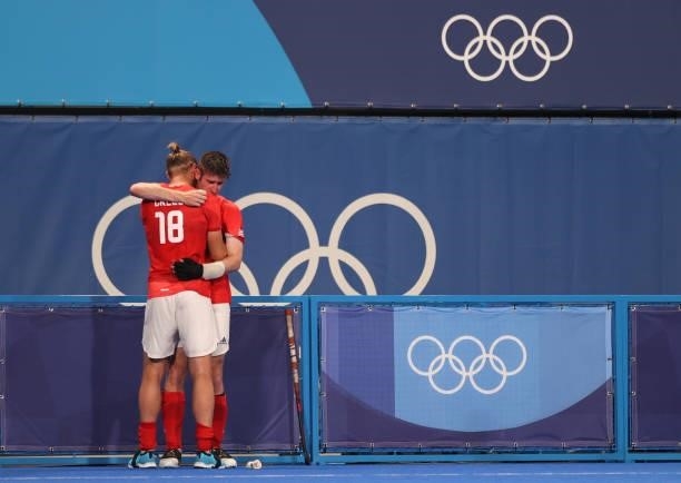 Brendan William John Creed of Team Great Britain embraces teammate Liam Sanford following a loss in the Men's Quarterfinal match between India and...