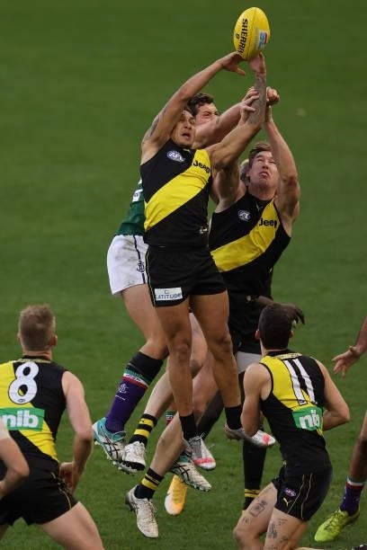 Shai Bolton of the Tigers contest for a mark during the round 20 AFL match between Fremantle Dockers and Richmond Tigers at Optus Stadium on August...