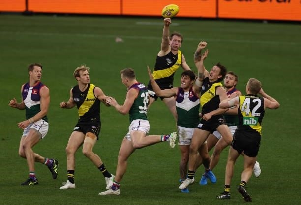 Dylan Grimes of the Tigers punches the ball during the round 20 AFL match between Fremantle Dockers and Richmond Tigers at Optus Stadium on August...