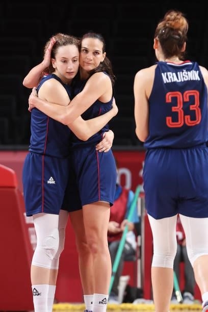 Aleksandra Crvendakic of Team Serbia and teammate Sonja Vasic celebrate with Tina Krajisnik after defeating Team South Korea in a Women's Basketball...