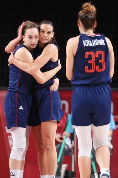 Aleksandra Crvendakic of Team Serbia and teammate Sonja Vasic celebrate with Tina Krajisnik after defeating Team South Korea in a Women's Basketball...