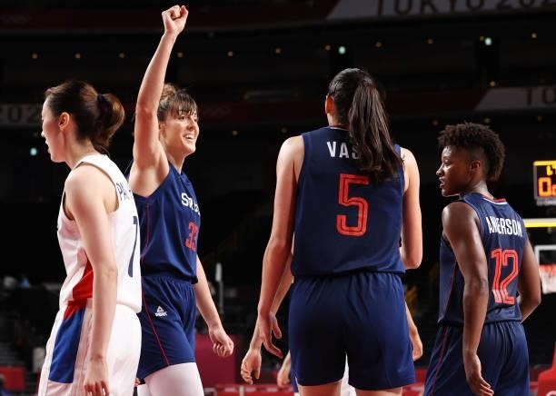 Tina Krajisnik of Team Serbia celebratwes with teammates Sonja Vasic and Yvonne Anderson during the second half of their Women's Basketball...