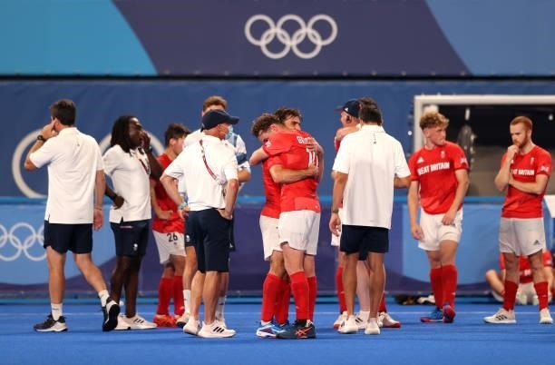 Adam Graham Dixon and Christopher Griffiths of Team Great Britain embrace following a loss in the Men's Quarterfinal match between India and Great...