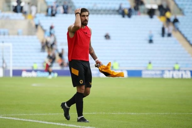 Ruben Neves of Wolverhampton Wanderers makes his way towards the fans to give them his shirt after the Pre-Season friendly match between Coventry...
