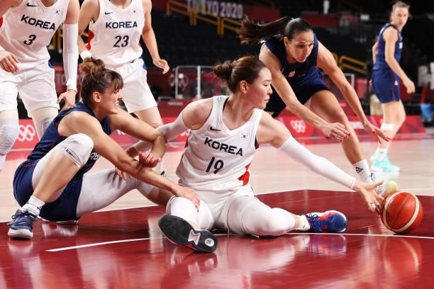 Ji Su Park of Team South Korea, Tina Krajisnik and Sonja Vasic of Team Serbia dive for a loose ball during the second half of a Women's Basketball...