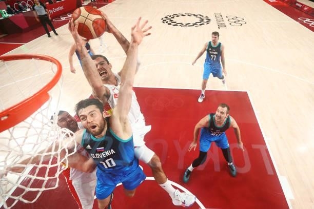Alberto Abalde of Team Spain drives to the basket against Mike Tobey of Team Slovenia during the second half of a Men's Basketball Preliminary Round...