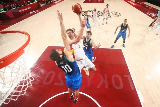 Pau Gasol of Team Spain shoots over Mike Tobey of Team Slovenia during the second half of a Men's Basketball Preliminary Round Group C game at...