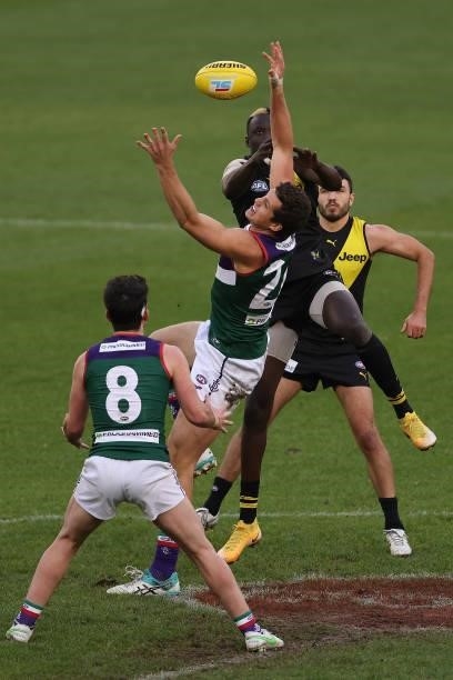 Lloyd Meek of the Dockers and Mabior Chol of the Tigers contest the ruck during the round 20 AFL match between Fremantle Dockers and Richmond Tigers...