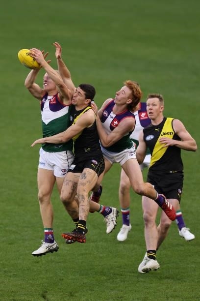 Hayden Young of the Dockers contests for a mark against Jason Castagna of the Tigers during the round 20 AFL match between Fremantle Dockers and...